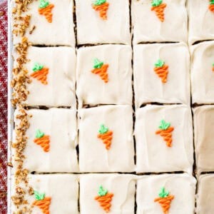 This Carrot Cake Sheet Cake recipe is tender, moist, and perfectly spiced. It's topped with a light and fluffy whipped cream cheese frosting and big enough for a crowd.