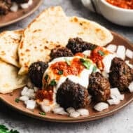 These Yogurtlu Kebabs turn ground beef into something special with creamy yogurt sauce and warm spiced tomato sauce.