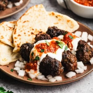 These Yogurtlu Kebabs turn ground beef into something special with creamy yogurt sauce and warm spiced tomato sauce.