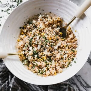 This mexican street corn pasta salad is creamy, zesty, and the easiest way to bring elote flavors to your next cookout.
