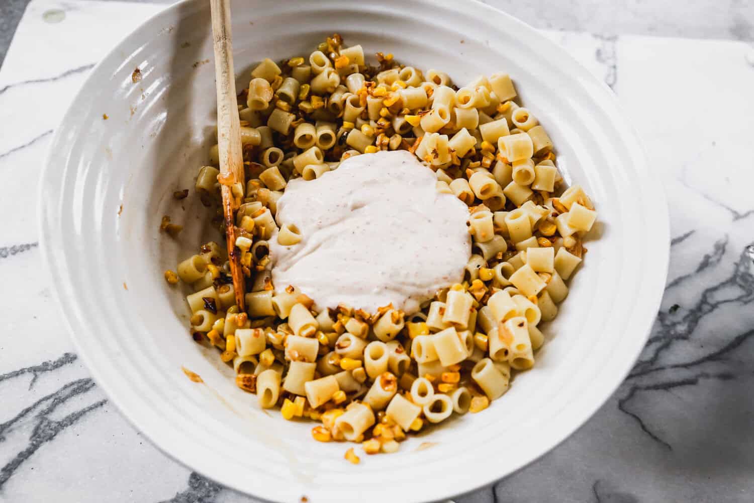 This Mexican street corn pasta salad comes together fast and is perfect for potlucks, picnics, and BBQs.
