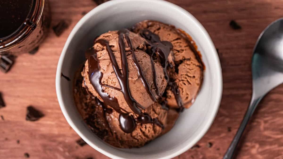 This homemade Chocolate Ice Cream recipe is rich, creamy, and perfect for any chocolate lover with ribbons of hot fudge throughout.