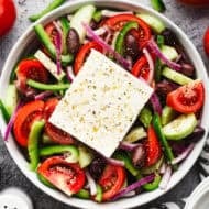 This easy Greek Salad recipe is bursting with flavor from fresh vegetables coated in a little bit of olive oil, vinegar, and seasonings. It's delicious and so quick!
