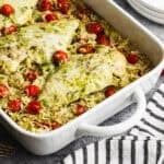 This easy Pesto Chicken Casserole recipe only takes 10 minutes to prep and bakes into a cheesy, creamy pesto chicken and rice dish that is flavorful and bound to get compliments!