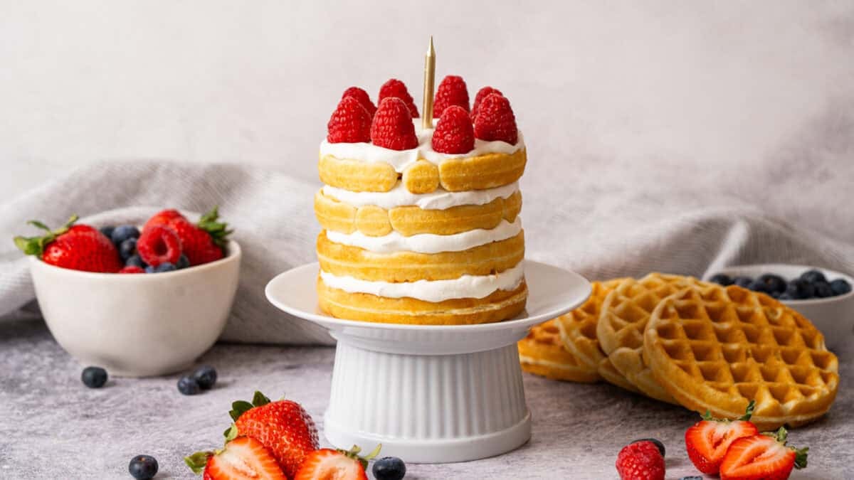 This easy mini waffle cake recipe is the perfect way to make someone feel special. We stack mini waffles and whipped cream to make it beautiful and easy. 
