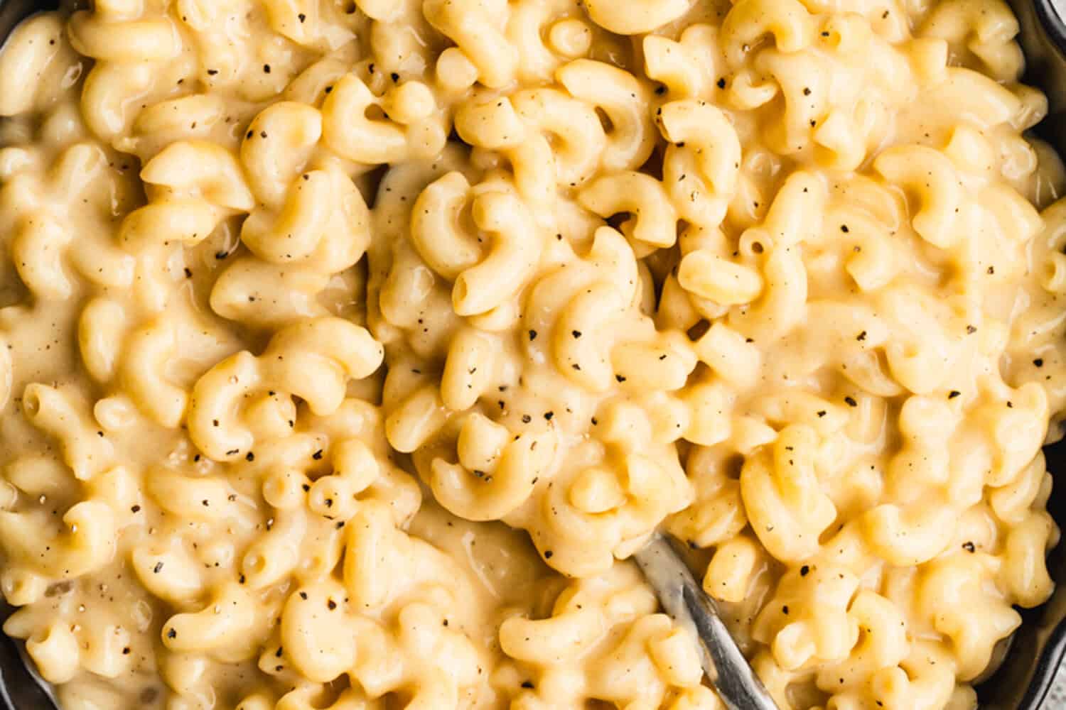 This high protein mac and cheese recipe is creamy, cheesy, and delicious while still helping you reach your protein goals.