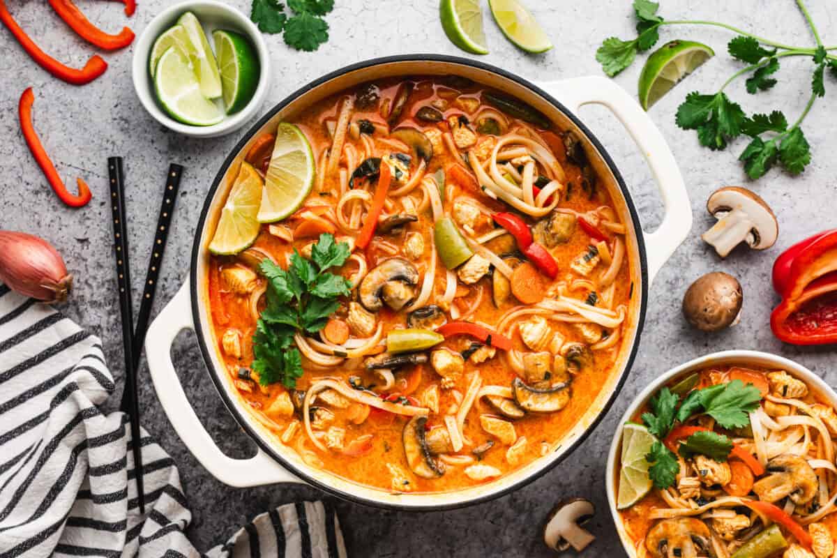The best Thai Noodle Soup has chicken, veggies, and such a delicious creamy broth with rice noodles. It's easy and so delicious!