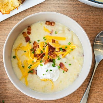Baked Potato Soup tastes a lot better when you bake the potatoes instead of boiling them, and you're left with crispy potato dippers!