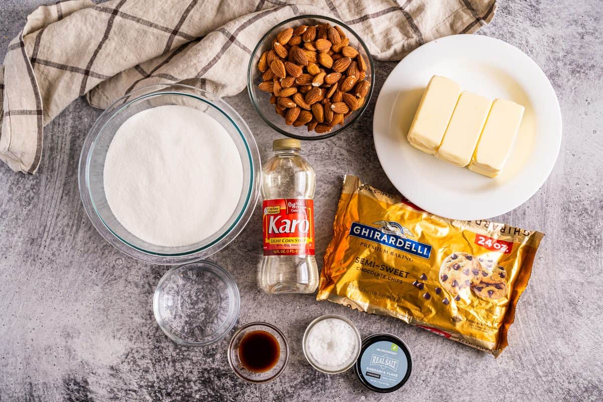 You can make homemade toffee from just simple ingredients: butter, sugar, light corn syrup, raw almonds, water, vanilla, chocolate chips, and flake salt.